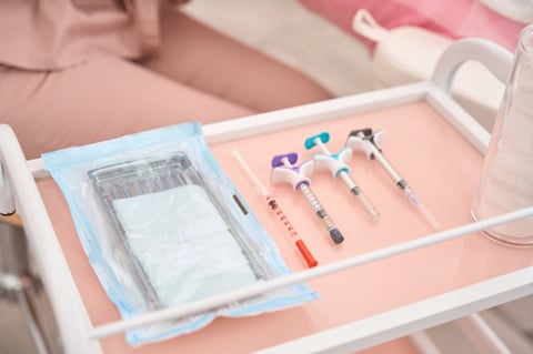 Injection table at the cosmetologists workplace with small syringes
